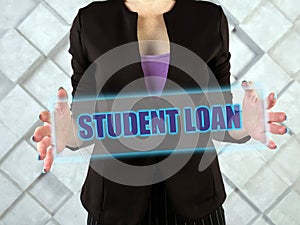 STUDENT LOAN phrase on the screen.  StudentÃÂ debt are funds that are owed on aÃÂ loanÃÂ taken out to pay for one`s education photo